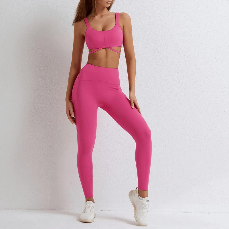 Seamless pink gym sports suit with bra and leggings, perfect for yoga and fitness. High-stretch nylon and spandex activewear for women.